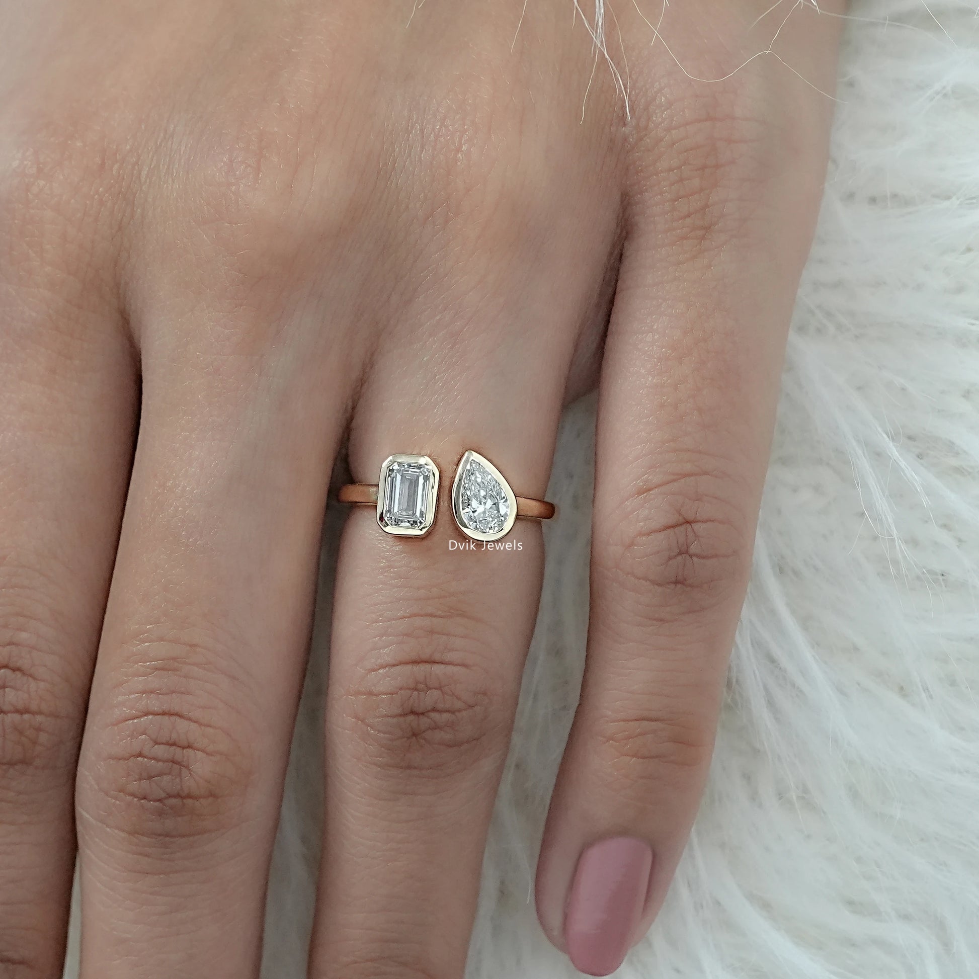 Emerald and Pear Cut Lab Grown Diamond Bezel Set Toi Moi Ring on hand showing dual-stone design