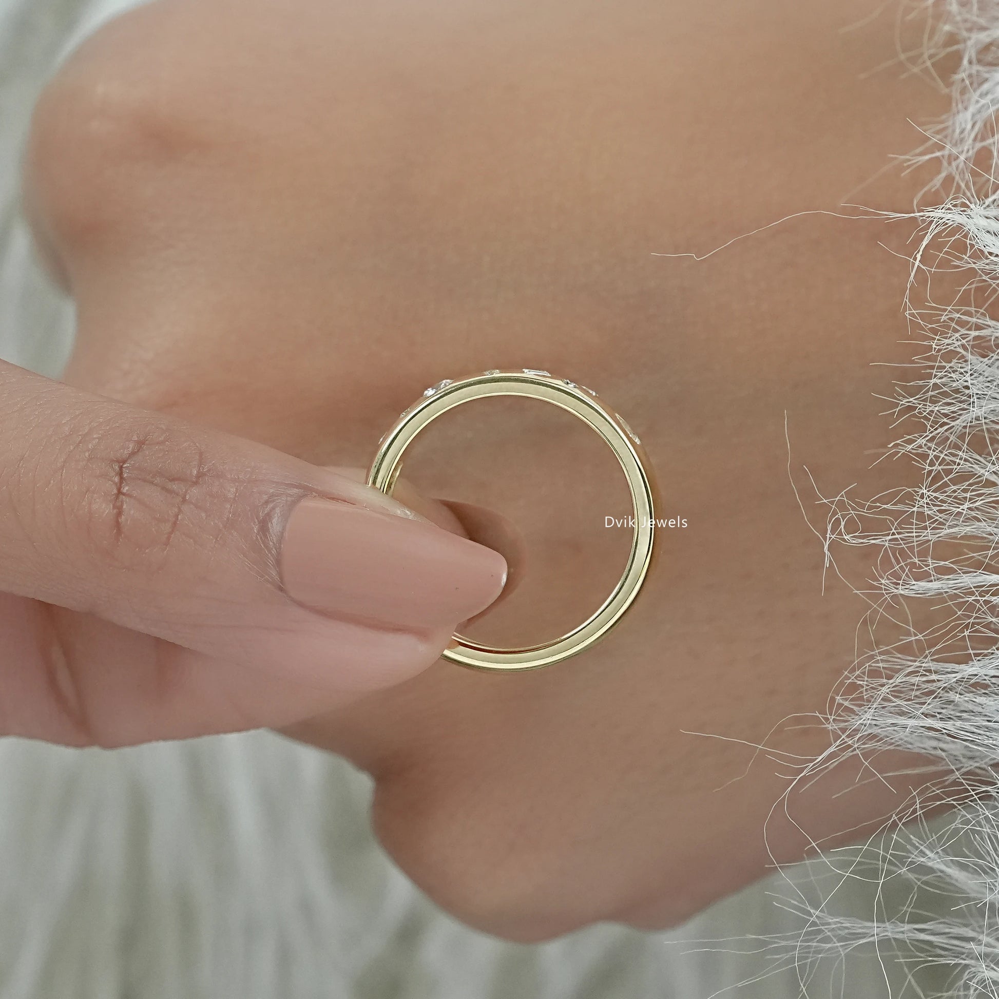 Flush set engagement ring close-up on a white surface for sharp detail