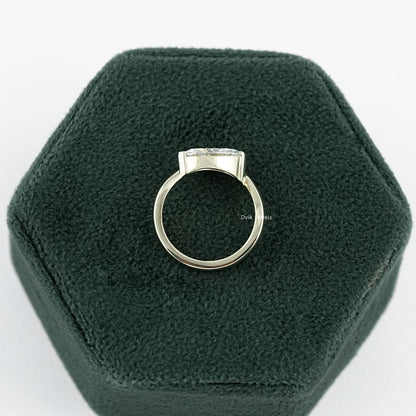 Lab Made Diamond Curved Marquise Cut Solitaire Engagement Ring held on jewelry box displaying mid-profile