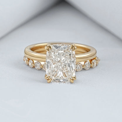 cushion cut diamond ring with a large center stone and a sleek 14k gold band.