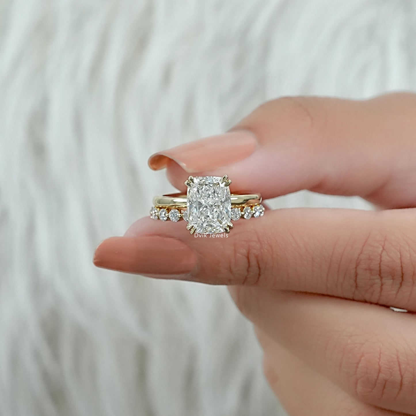 lab grown diamond ring in a classic four-prong setting on a 14k gold band.