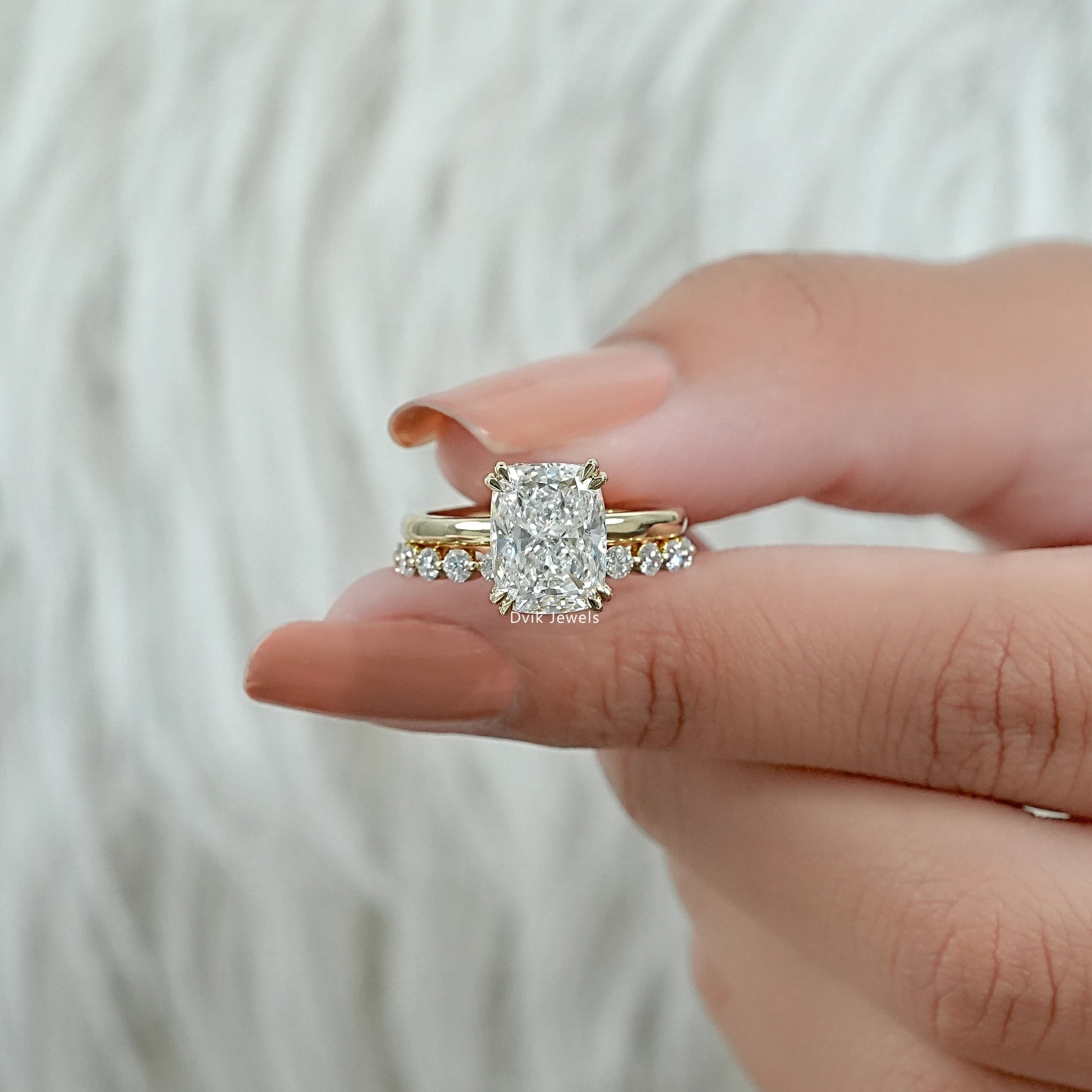 lab grown diamond ring in a classic four-prong setting on a 14k gold band.