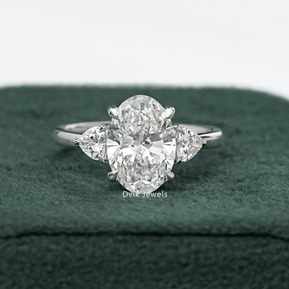 Three-Stone Oval And Round Cut Diamond Ring