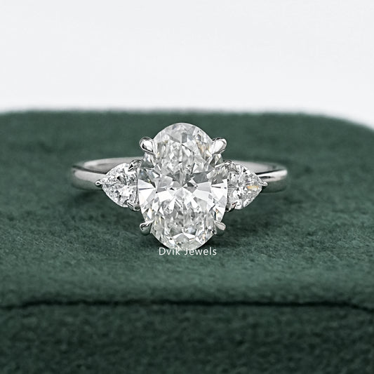 Three-Stone Oval And Round Cut Diamond Ring