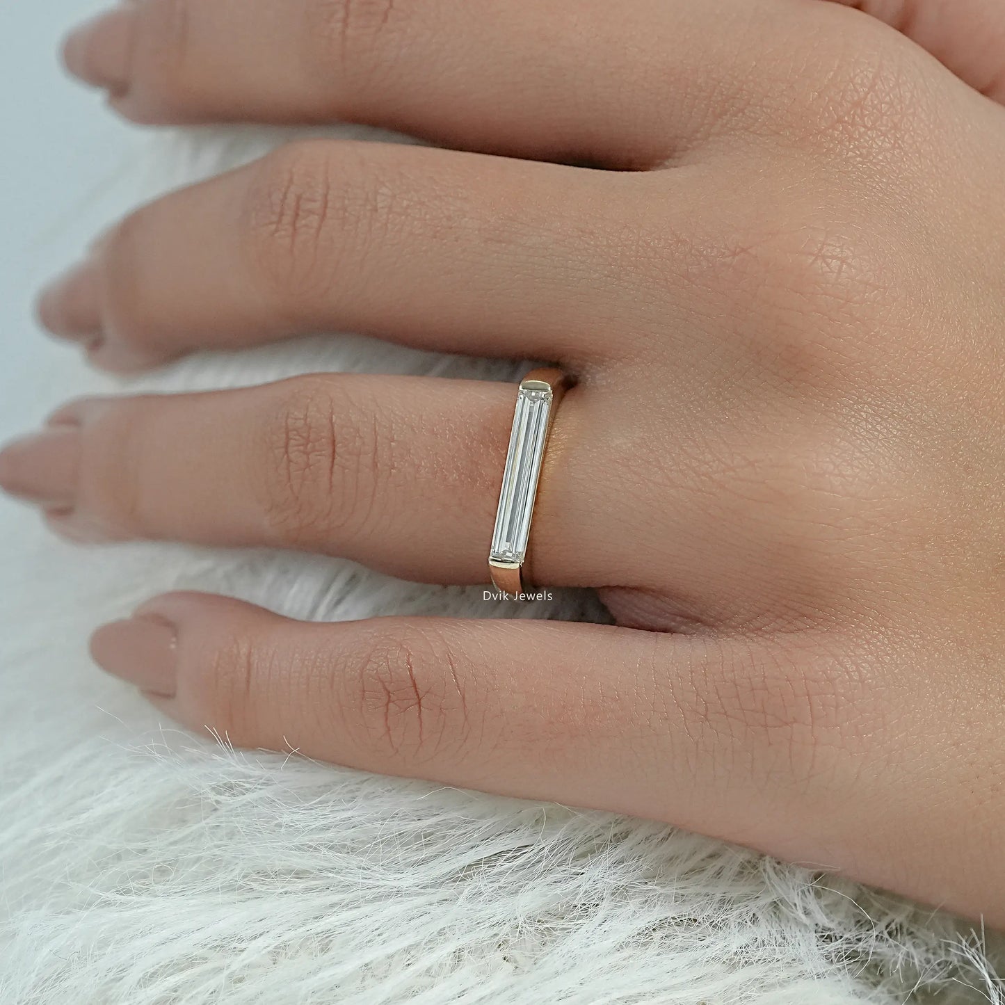 Horizontal baguette diamond ring shown in a detailed close-up view