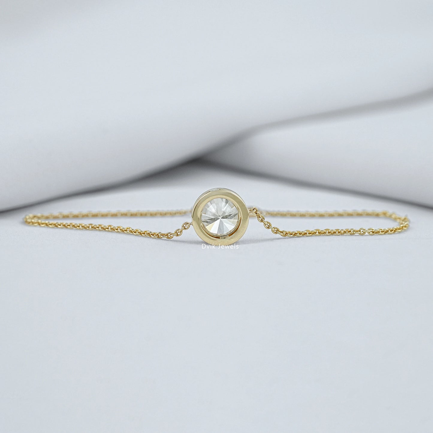 Gold chain bracelet with diamonds bezel setting in jewelry box