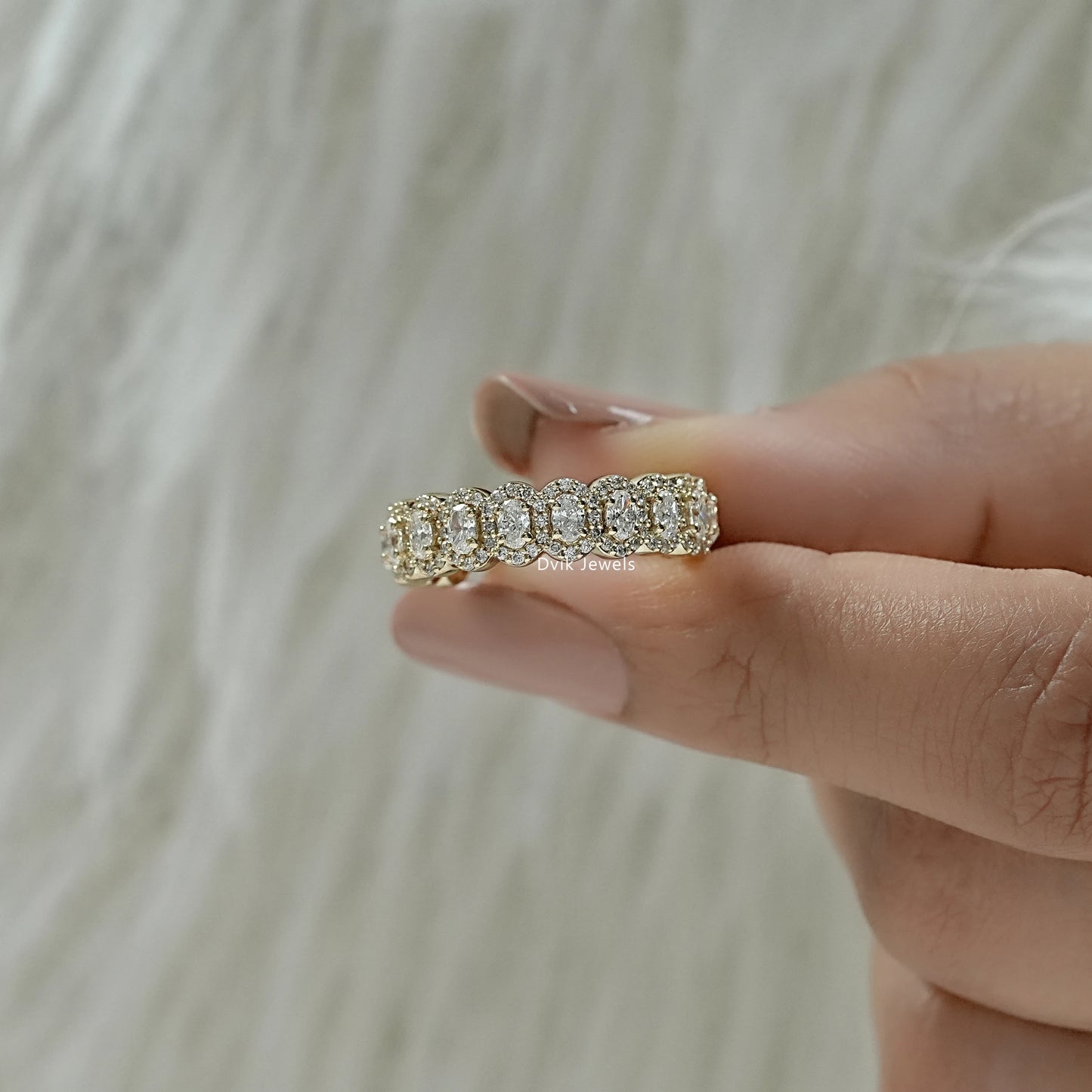 Oval half eternity band close-up for a detailed jewelry view.