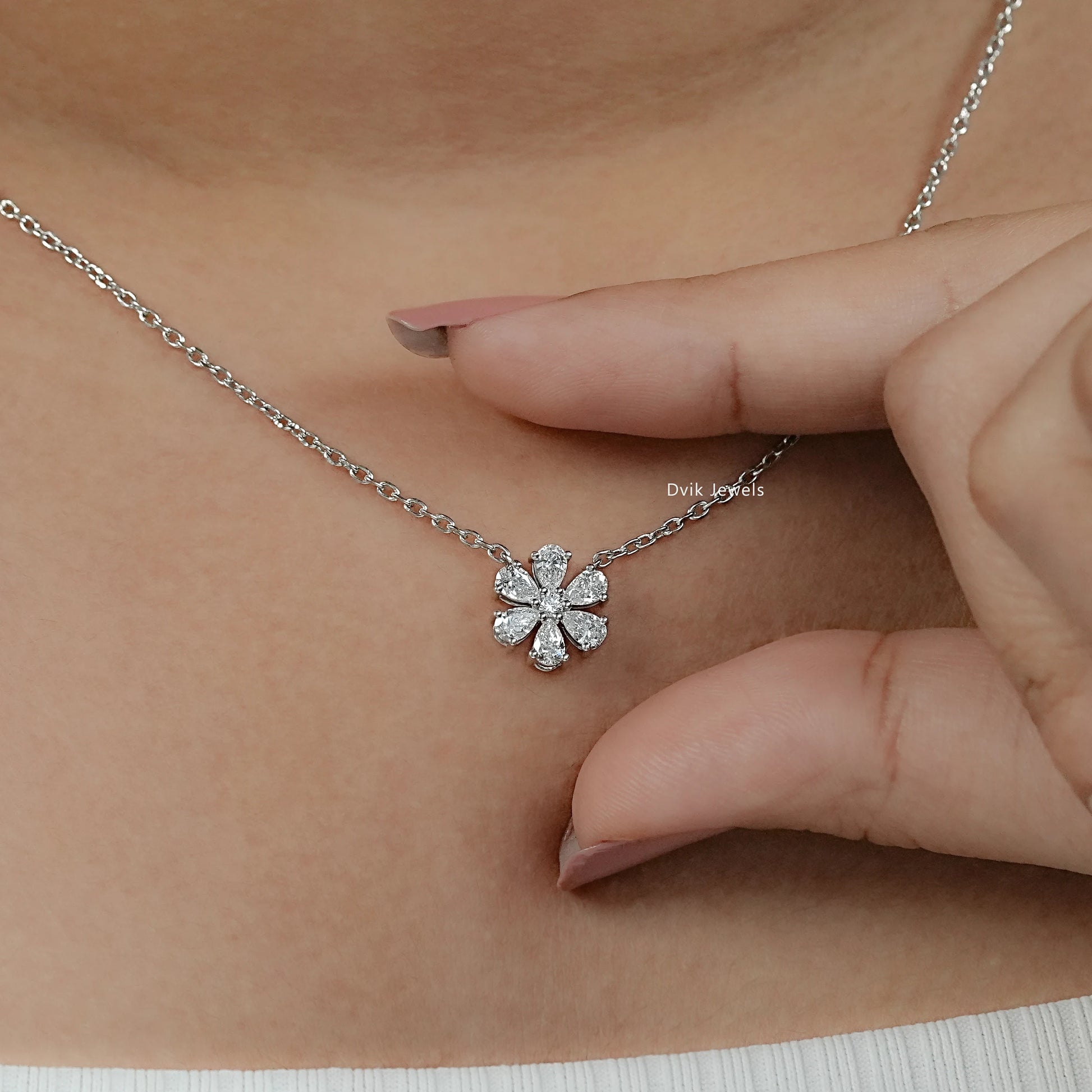 Round and pear cut floral pendant on neck, perfect for everyday or bridal jewelry piece