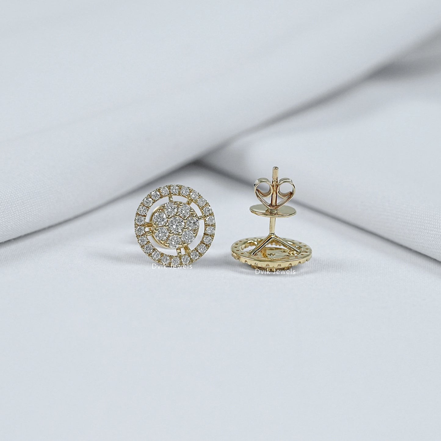 Front and back view of round cut halo diamond studs showing yellow gold butterfly push-back closure