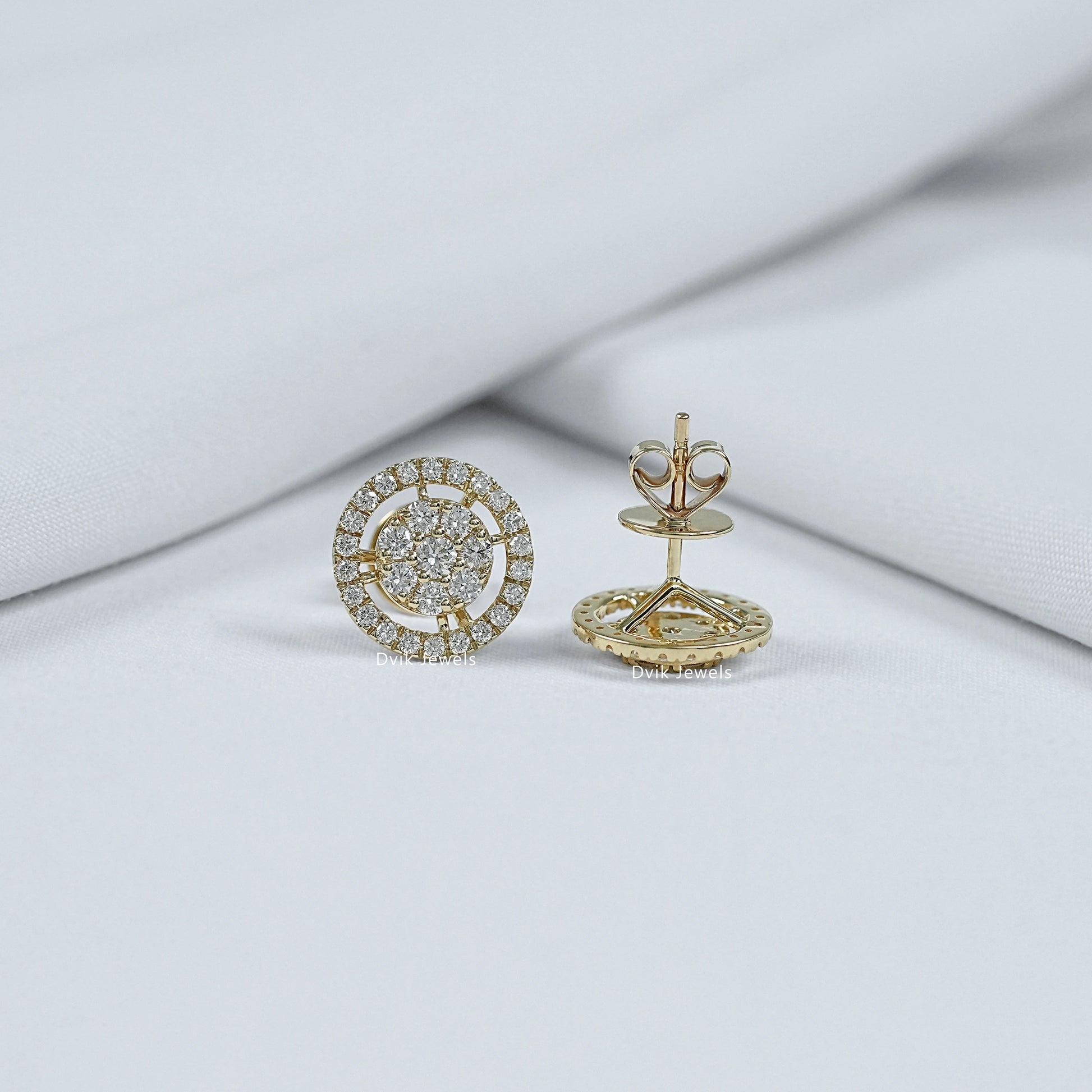 Front and back view of round cut halo diamond studs showing yellow gold butterfly push-back closure