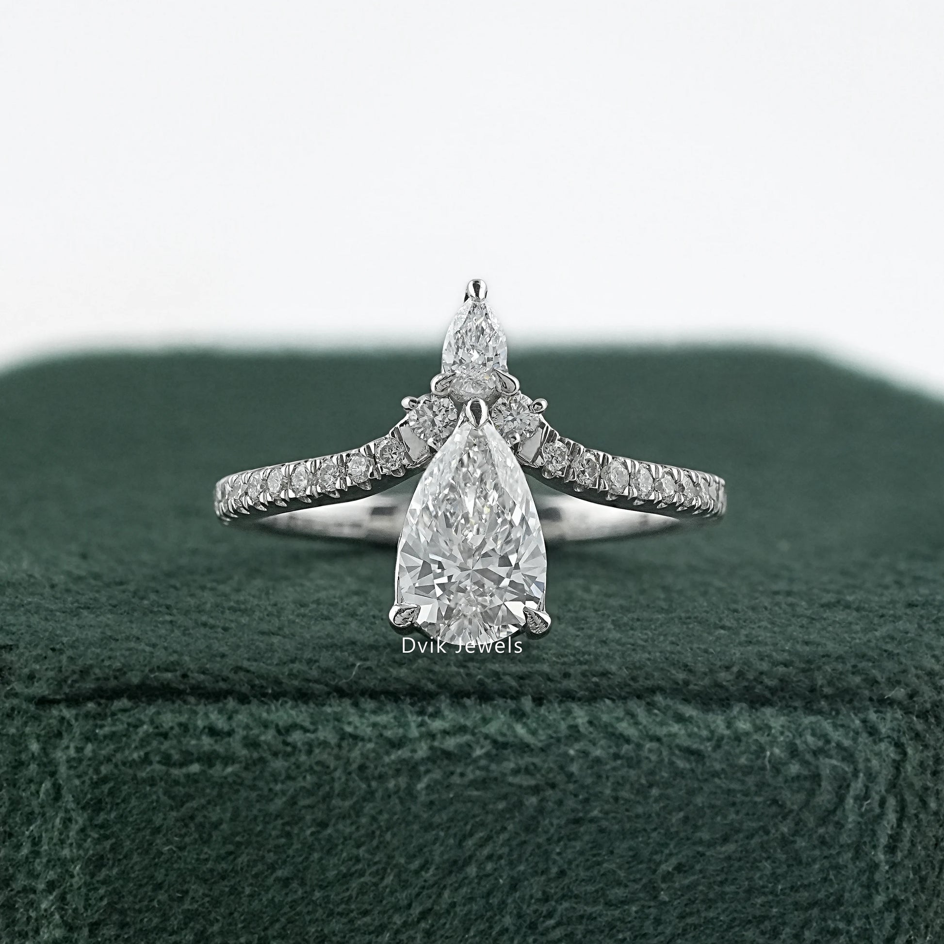 Dvik Jewels display double pear cut lab diamond accent set ring on green box