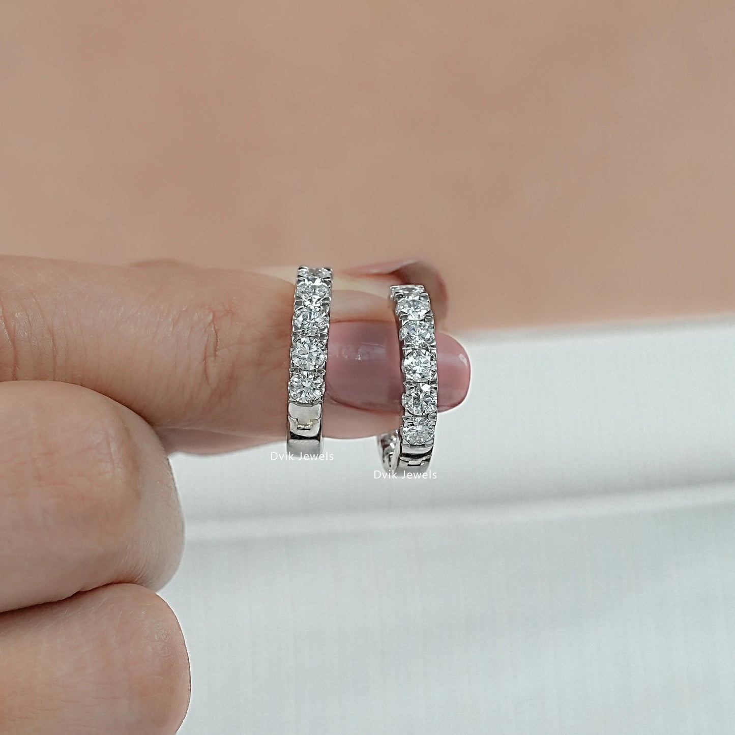 Side angle view of lab grown diamond hoop earrings 2 carat style showing the high-clarity stones.