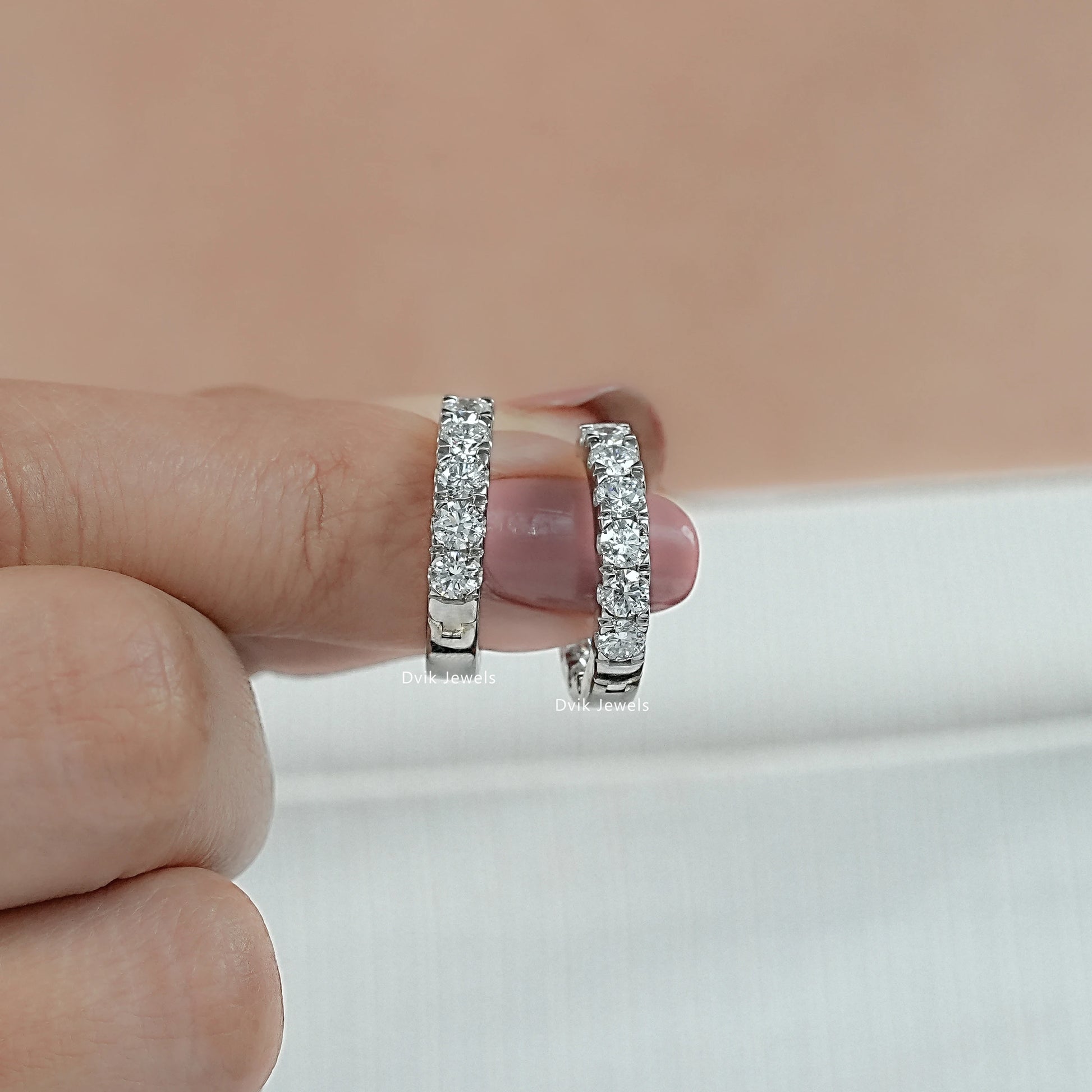 Side angle view of lab grown diamond hoop earrings 2 carat style showing the high-clarity stones.