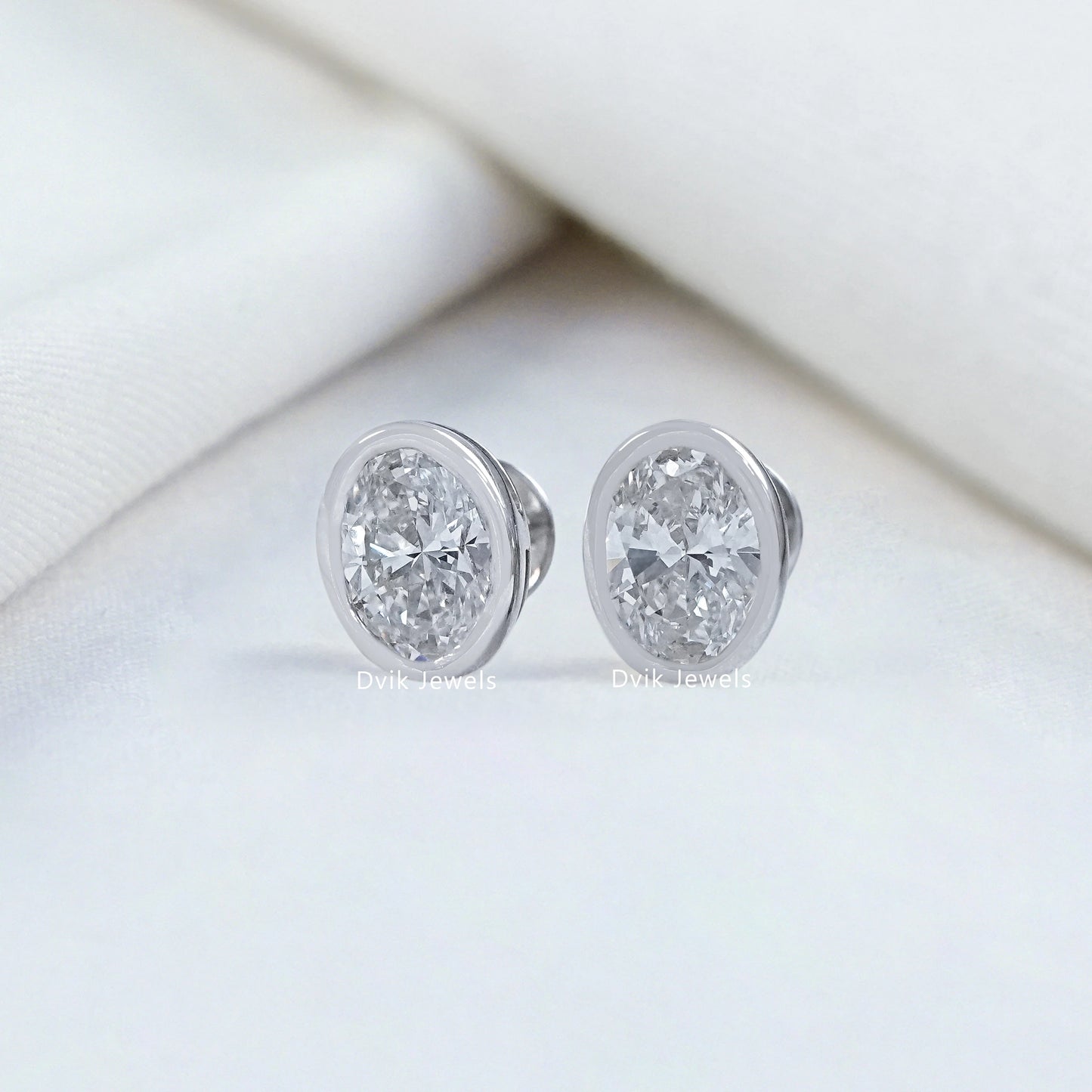 Oval Cut Lab Diamond Bezel Set Stud Earrings