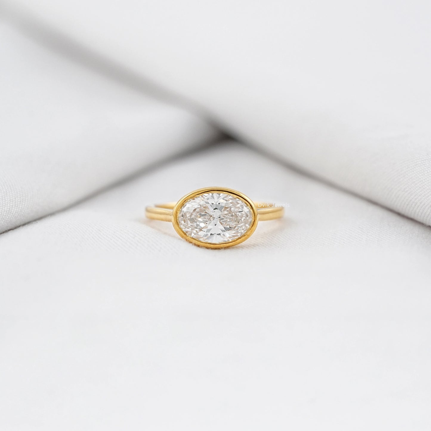 Oval East-West Bezel Engagement Ring
