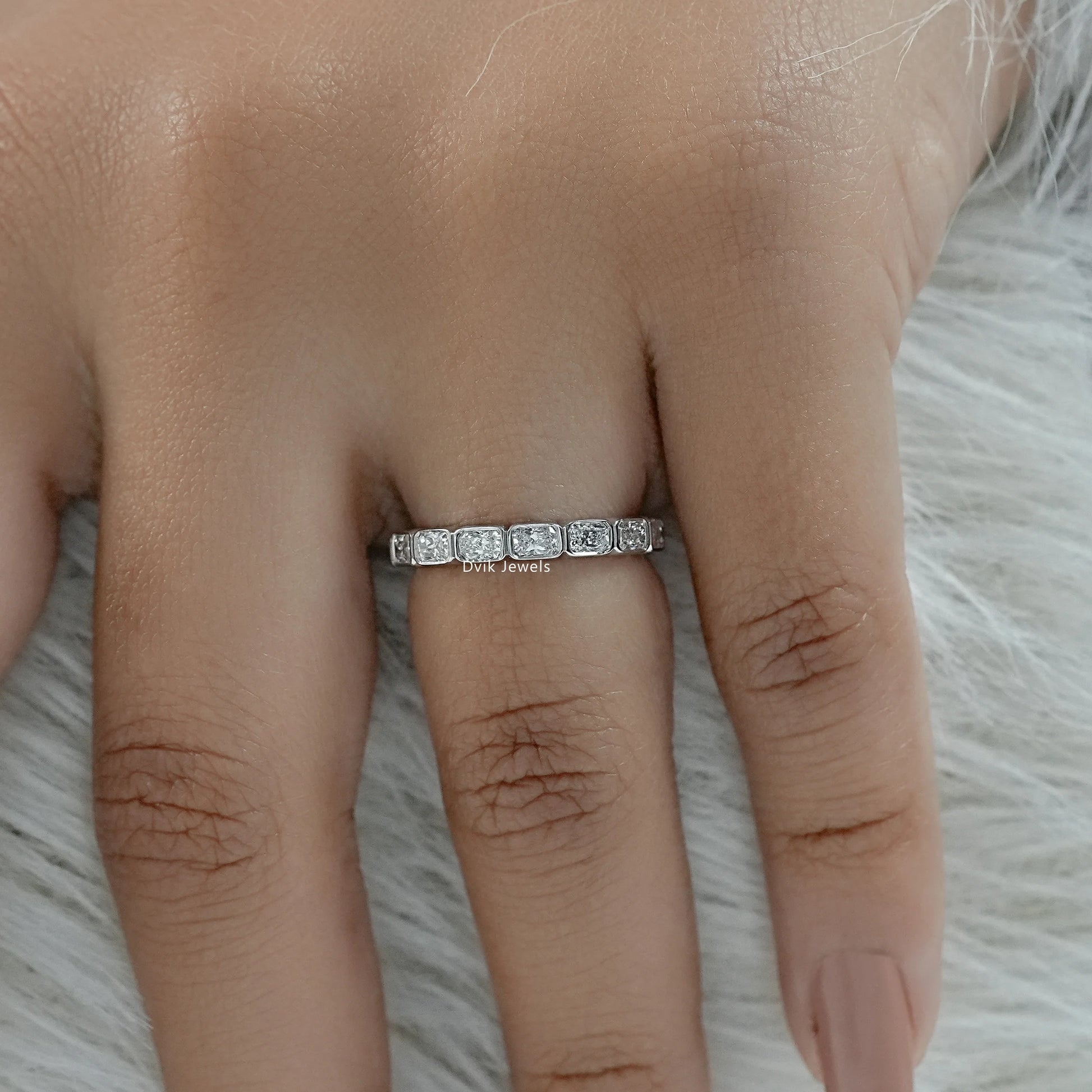 Radiant cut eternity band lab grown diamonds worn for a bridal look