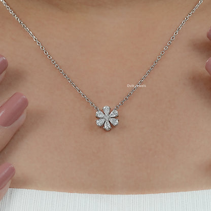 Women wear lab diamond floral pendant to display how flower design sits on neckline