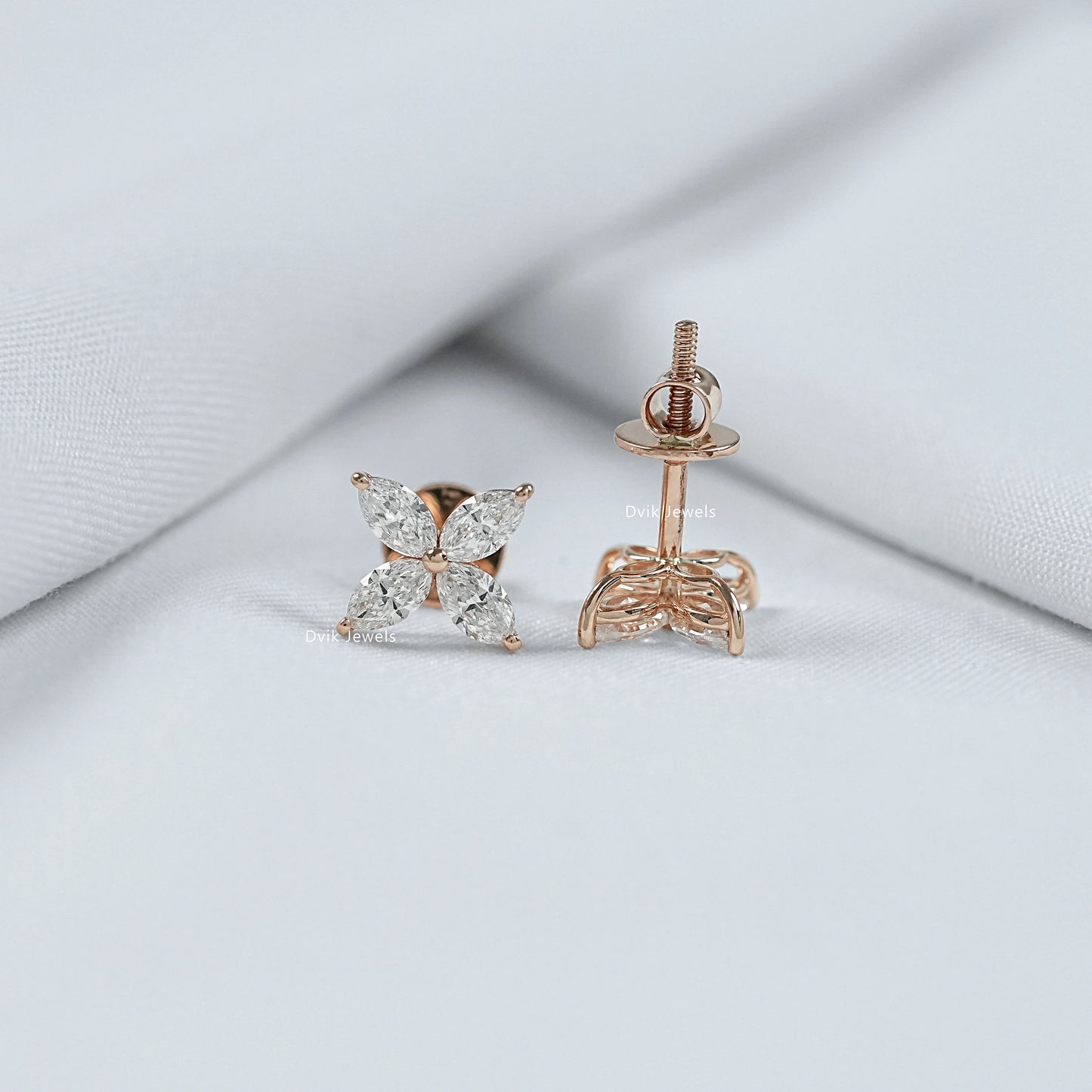 Tilted view of lab grown diamond earrings highlighting the sharp marquise cut stones and shape.