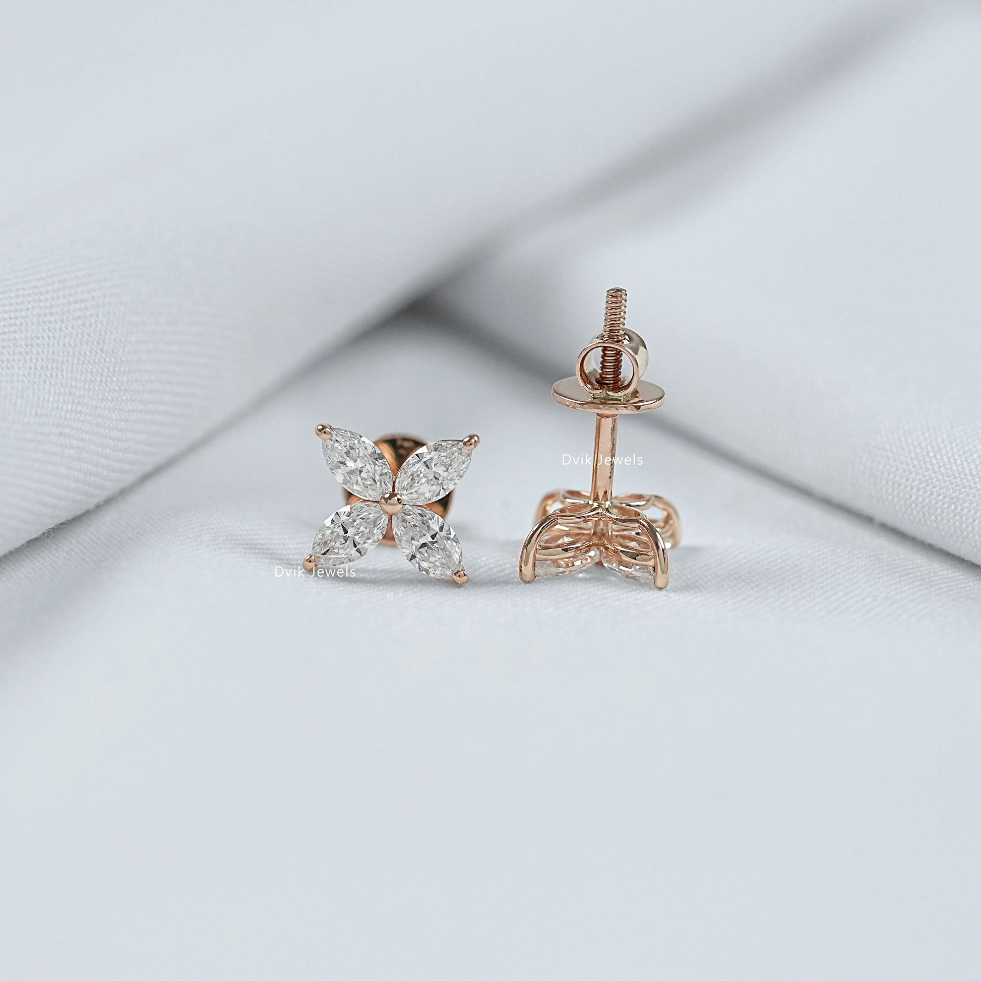 Tilted view of lab grown diamond earrings highlighting the sharp marquise cut stones and shape.