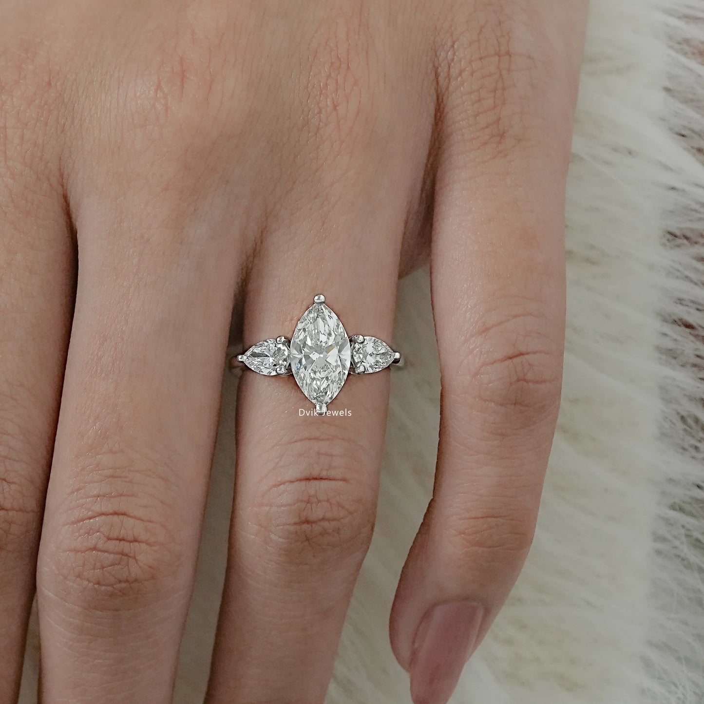 Lab Grown Diamond Marquise Cut Three Stone Engagement Ring worn on finger