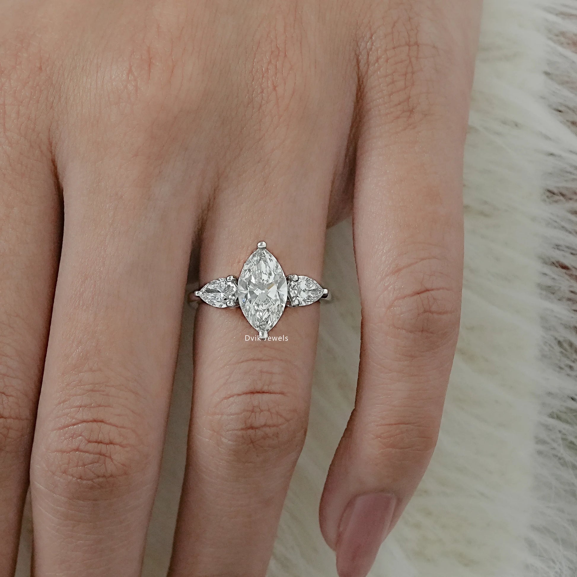 Lab Grown Diamond Marquise Cut Three Stone Engagement Ring worn on finger
