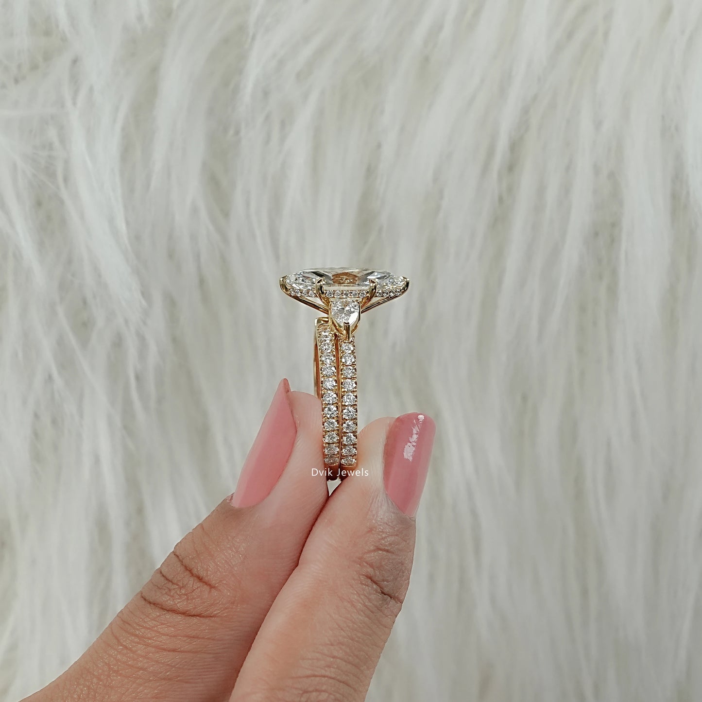 Women holding lab grown diamond rings bridal set with marquise shape diamond for side view