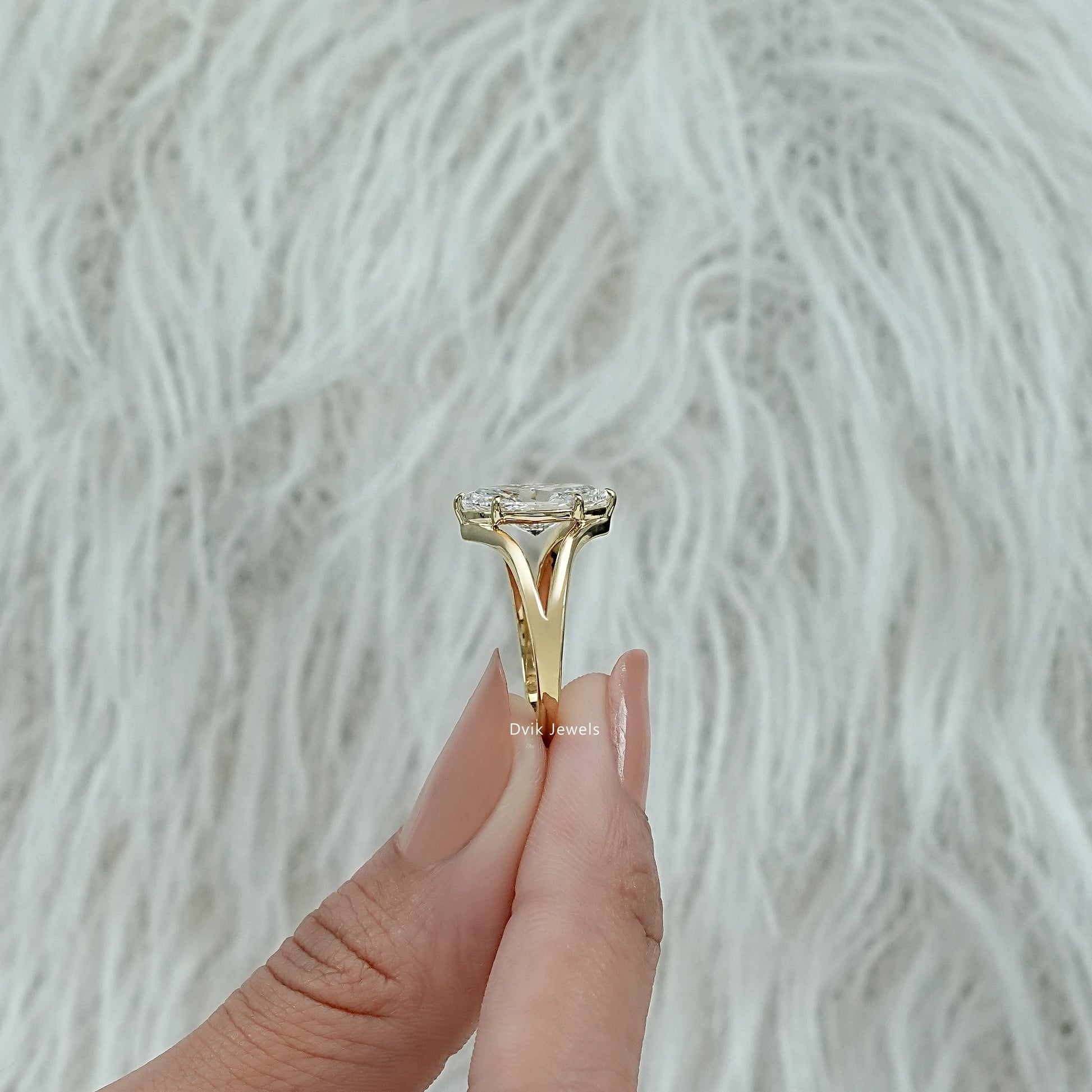 Navette engagement ring laid flat to highlight the detailed prong setting