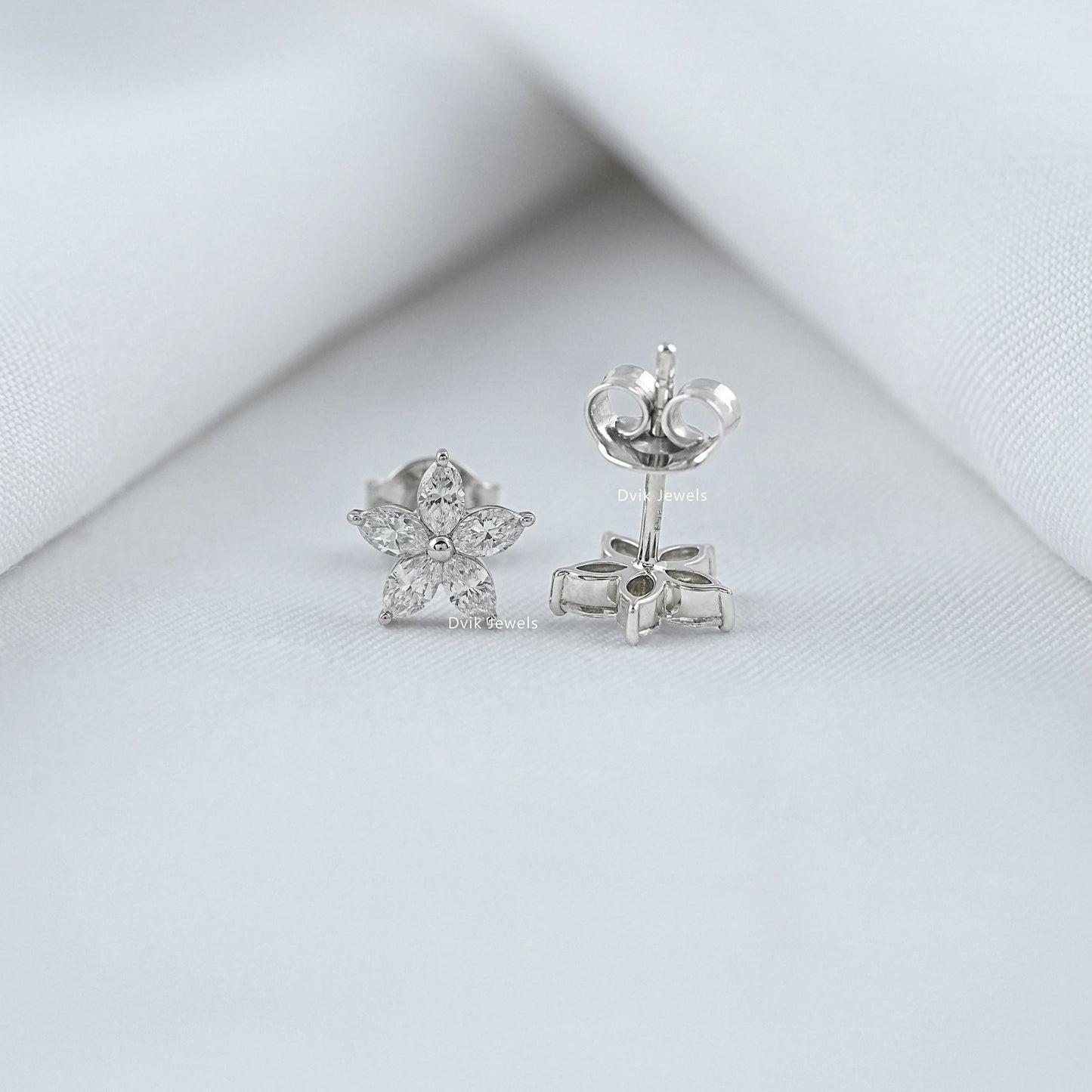 Front and side view of lab diamond marquise cut stud earrings showing butterfly back closure