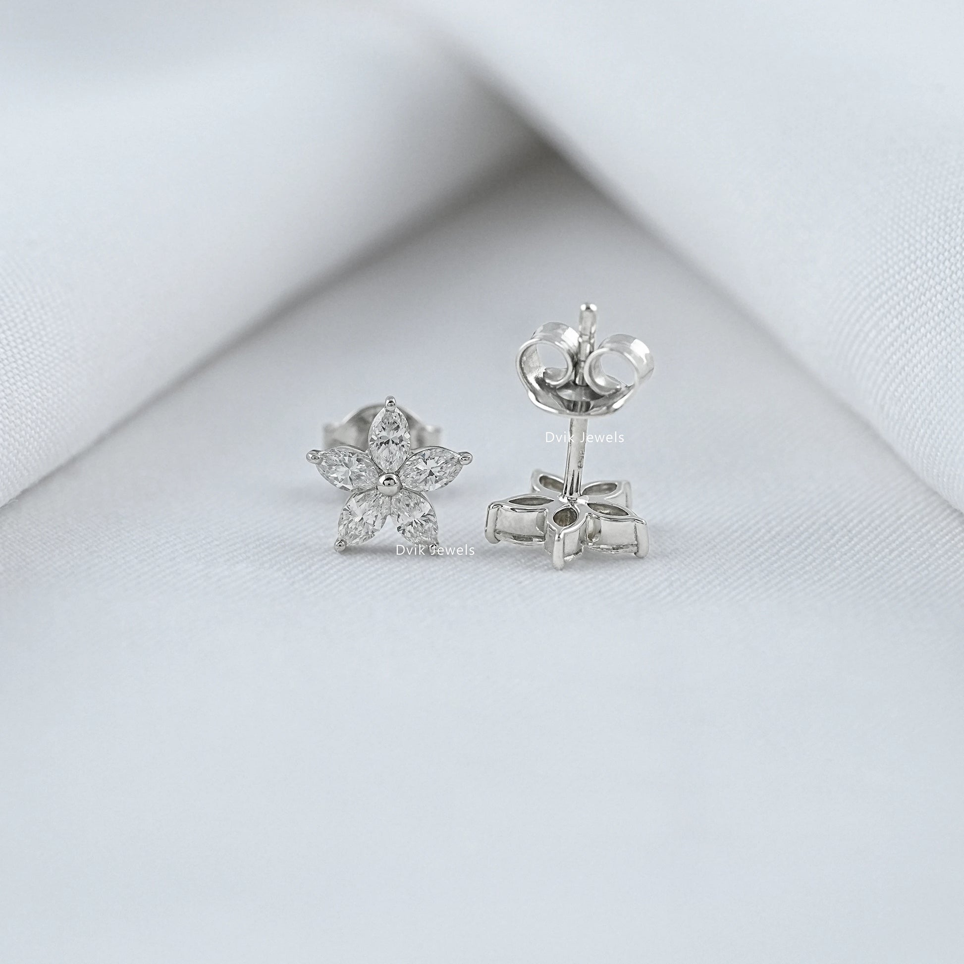 Front and side view of lab diamond marquise cut stud earrings showing butterfly back closure