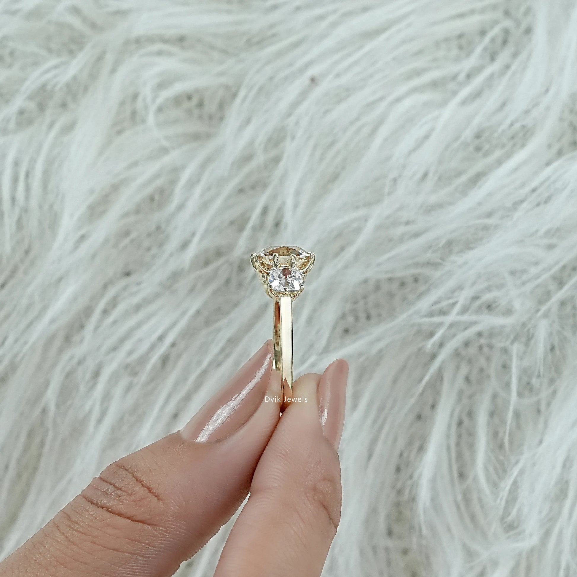 3 carat cushion cut diamond ring worn on a finger for a luxury showcase
