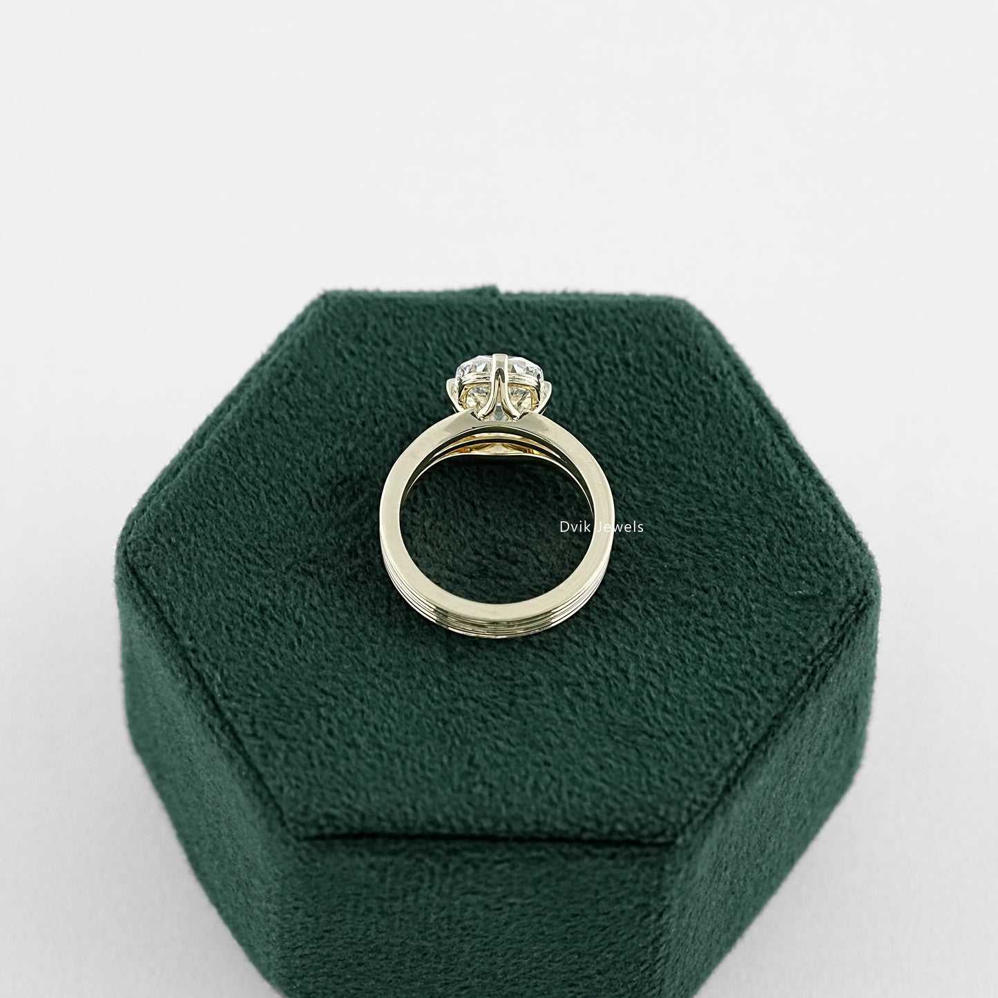 Old Mine Lab Diamond Cushion Cut Multi Band Solitaire Ring with different metal tone in  side profile on jewelry box