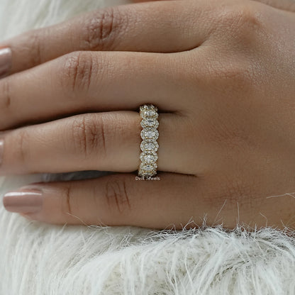 Oval cut diamond wedding band with a unique halo cluster design.