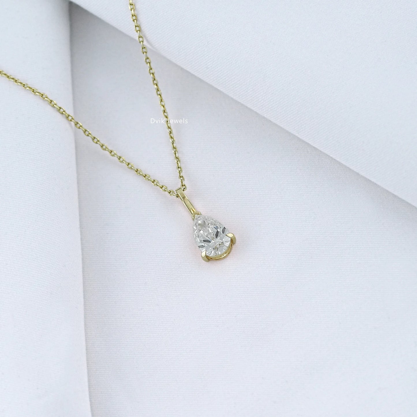 Angled view of pear diamond solitaire necklace with EF_VS clarity of lab grown diamond