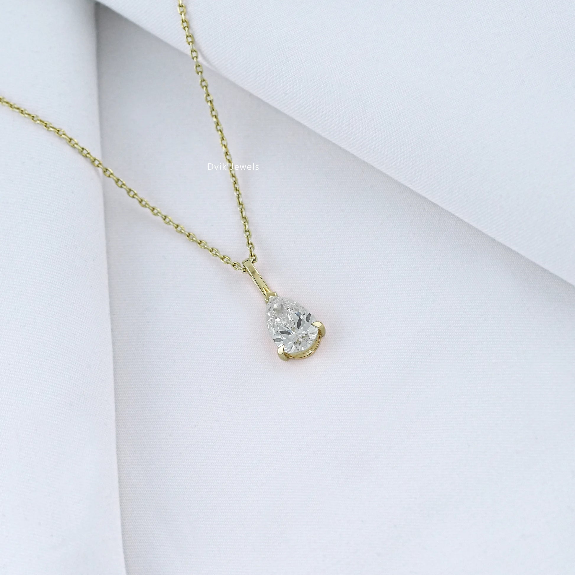 Angled view of pear diamond solitaire necklace with EF_VS clarity of lab grown diamond