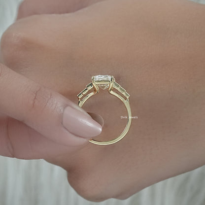 Emerald cut engagement rings with baguettes highlighting the side accents.