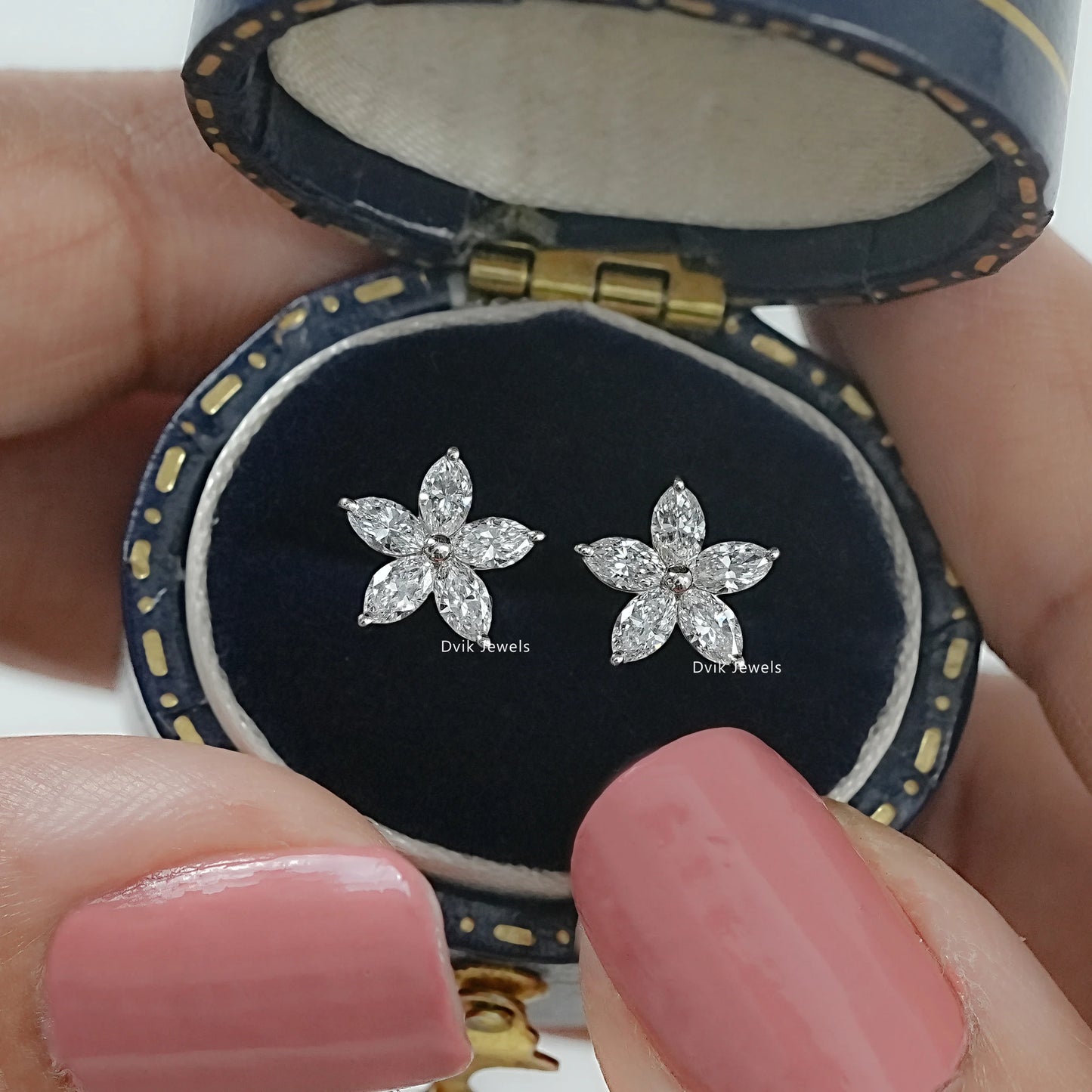Pair of marquise cut lab diamond floral stud earrings in jewelry box by Dvik Jewels
