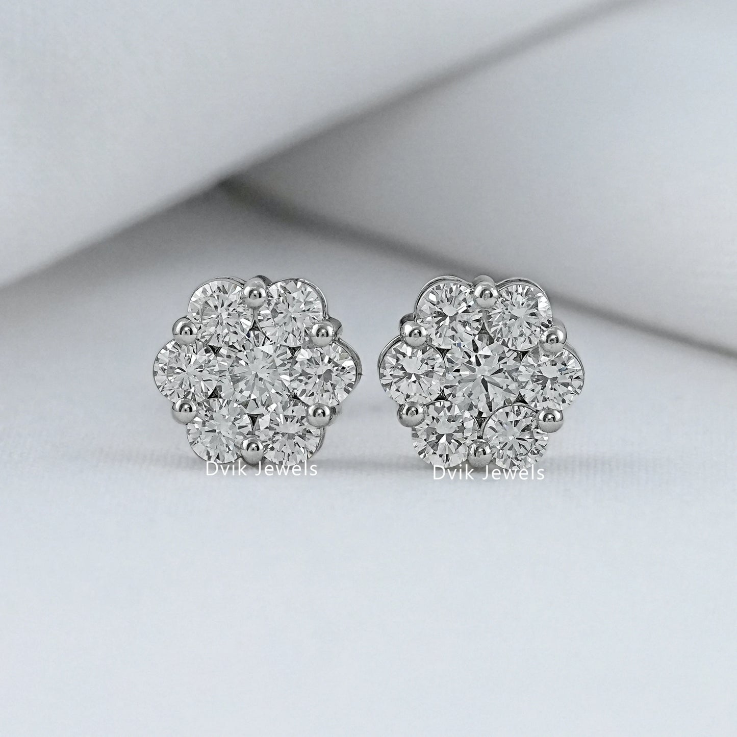 Front view of floral round diamond stud earrings with cluster pattern
