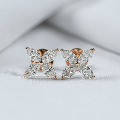 Back and front view of marquise diamond stud earrings showing the high-quality metal finish.
