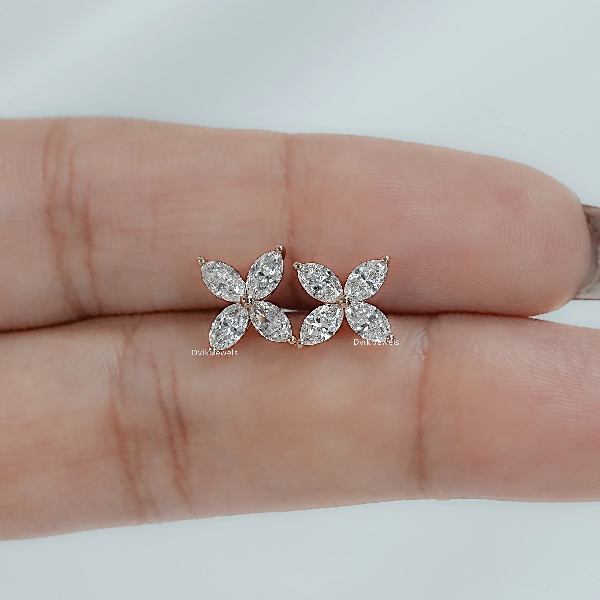 Side angle view of Marquise Cluster Earrings displaying the secure gold post and petal design.