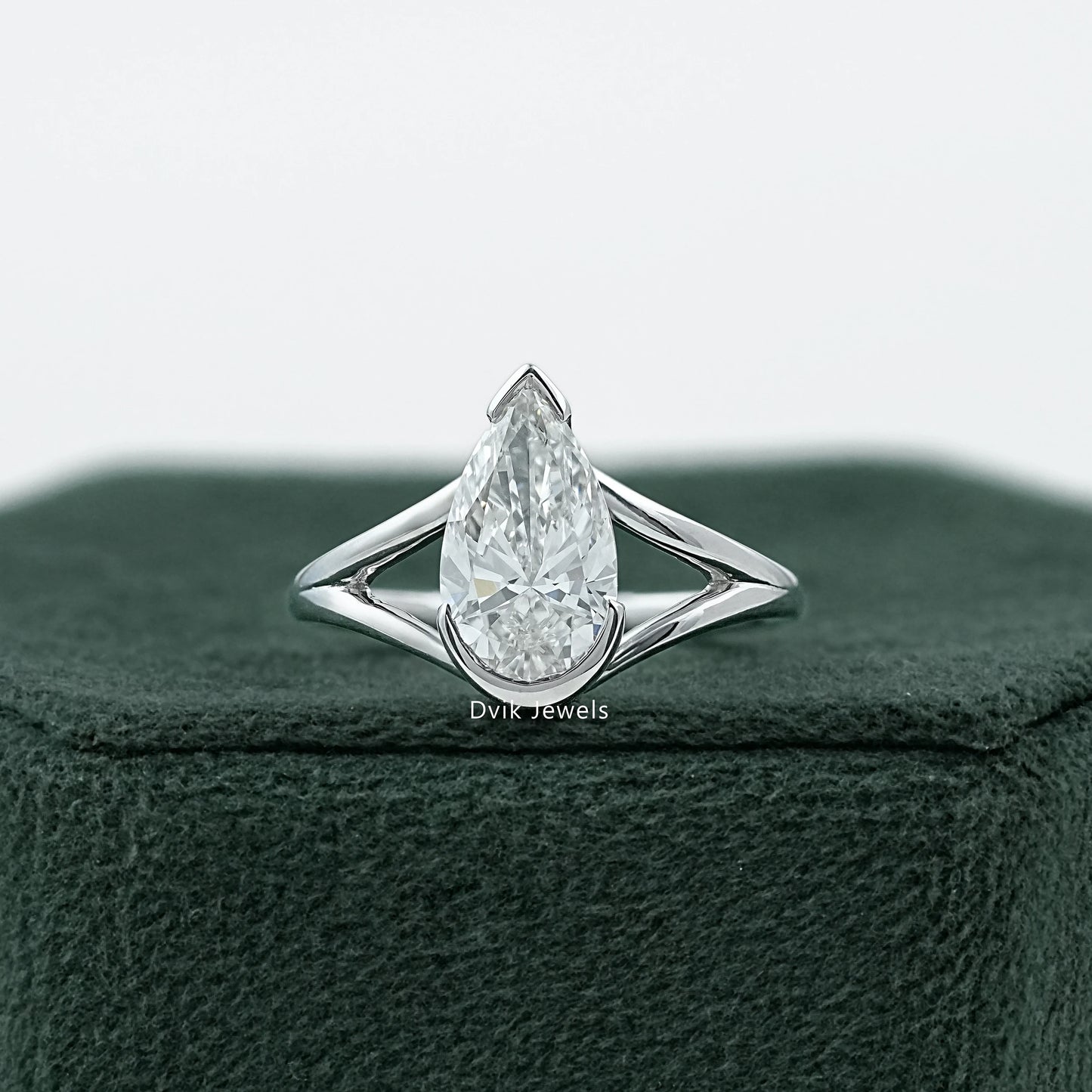 Half Bezel Pear Cut Split Shank Ring