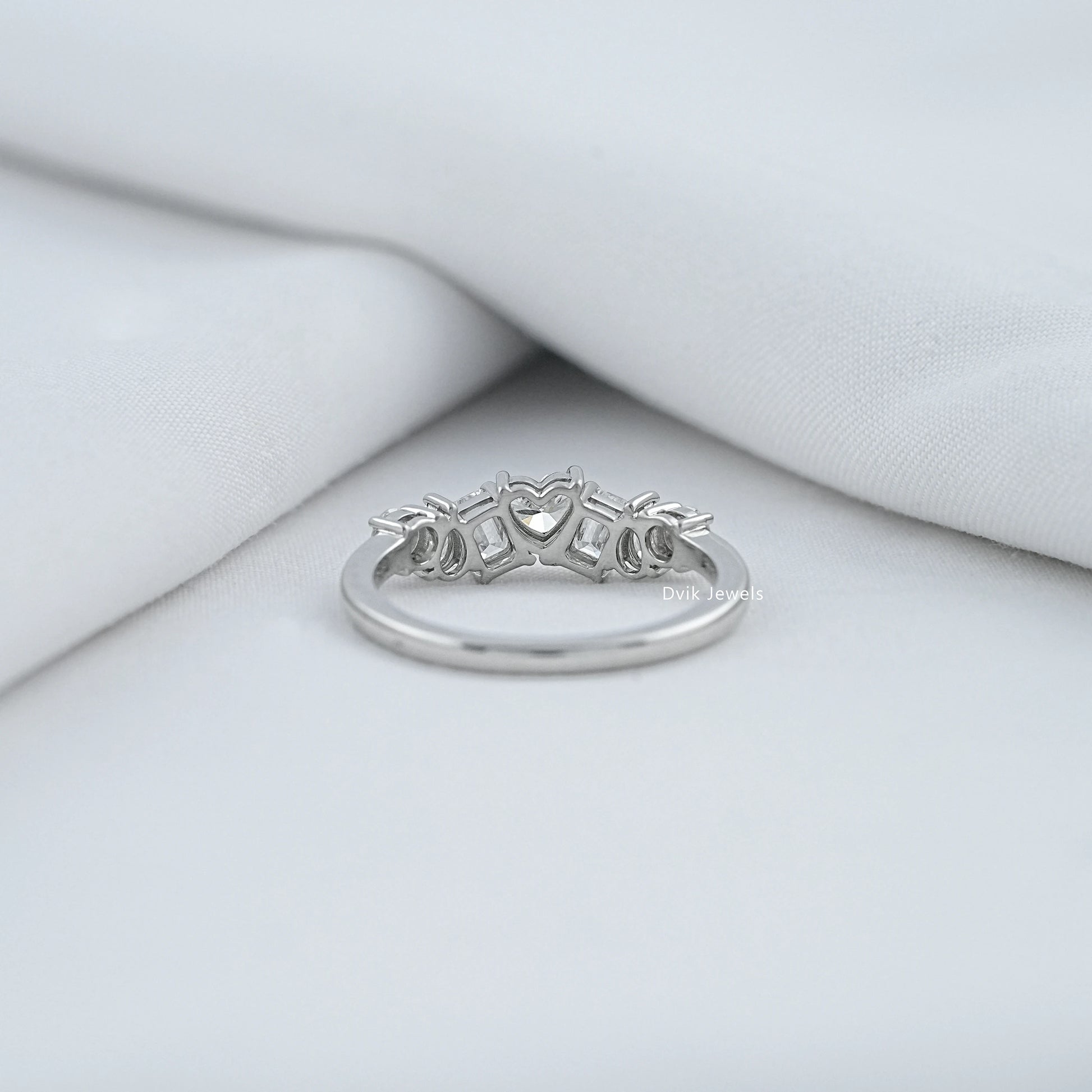 Back view of a mixed shape diamond eternity band showing the secure open-back setting.