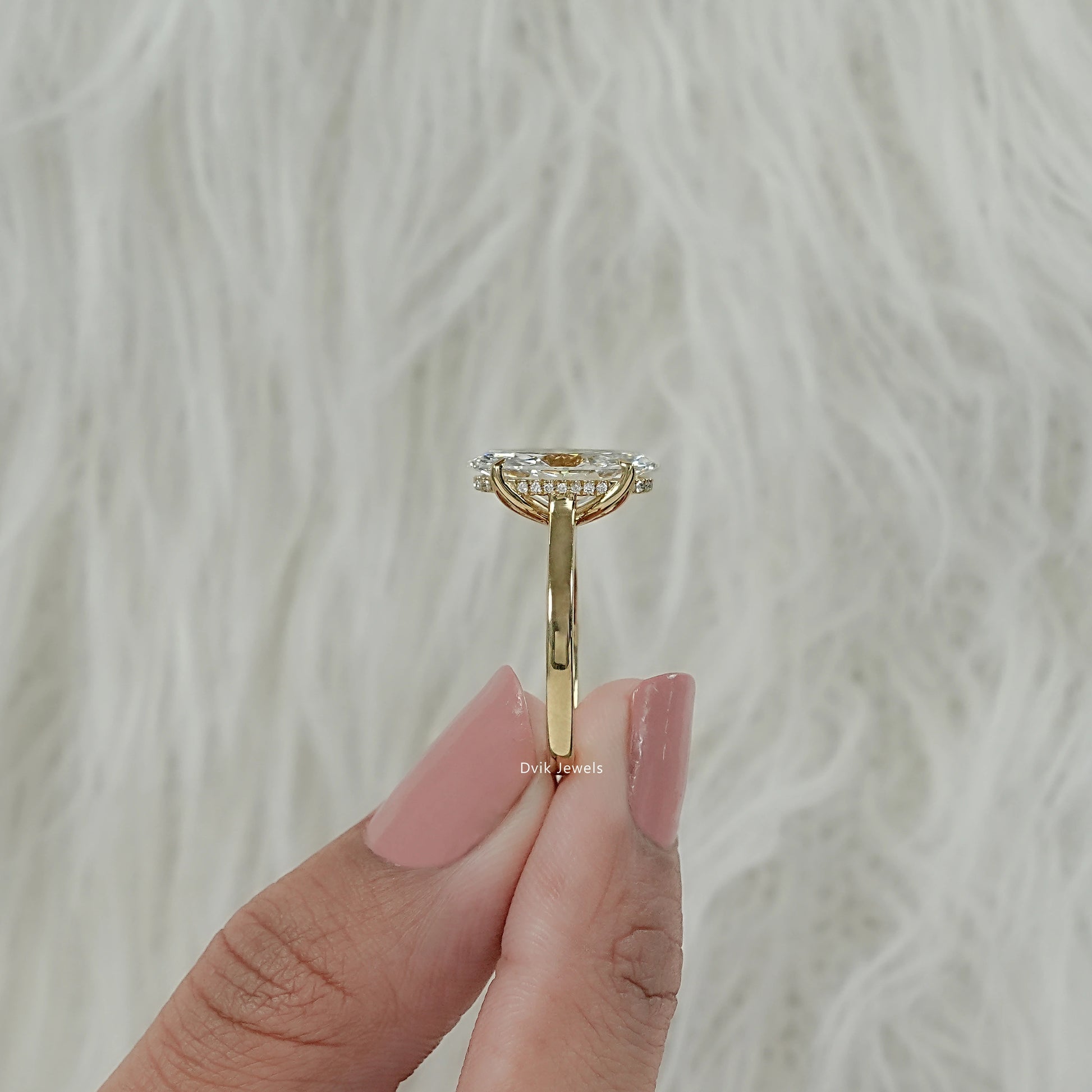 Side view of moval hidden halo diamond ring for women, perfect for everyday wear