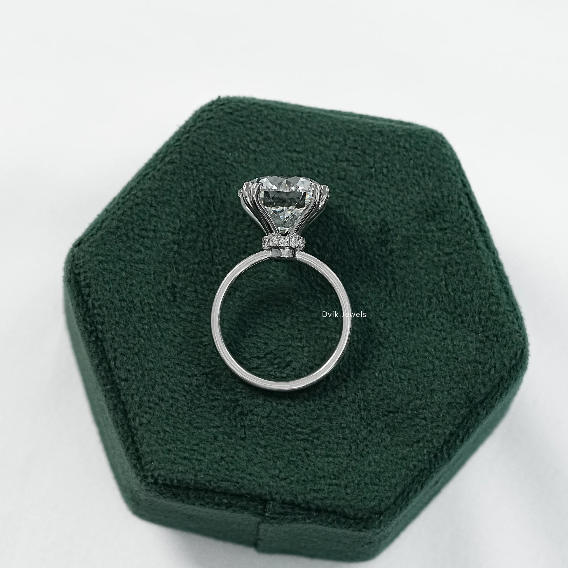 Round engagement ring with hidden halo and 6 prong setting side view