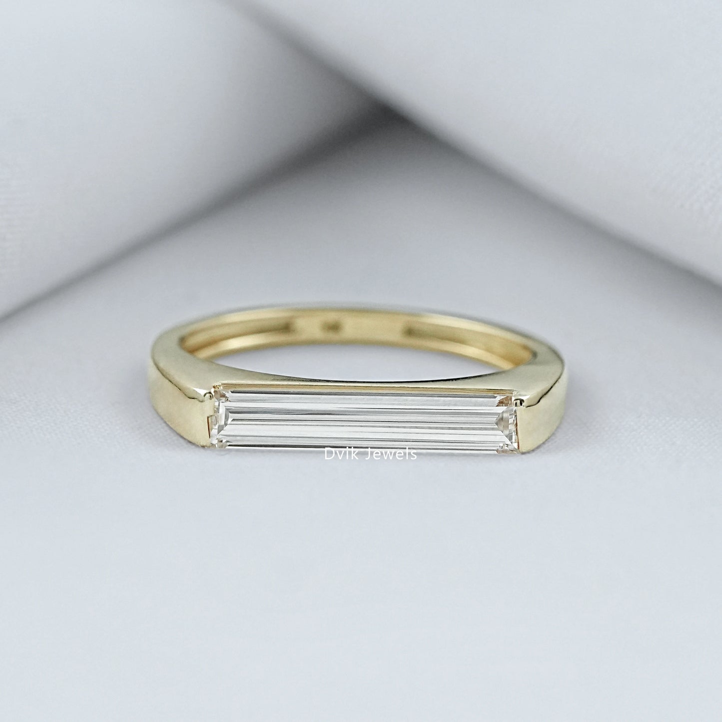 East West Baguette Diamond Ring in a 14k gold bezel setting