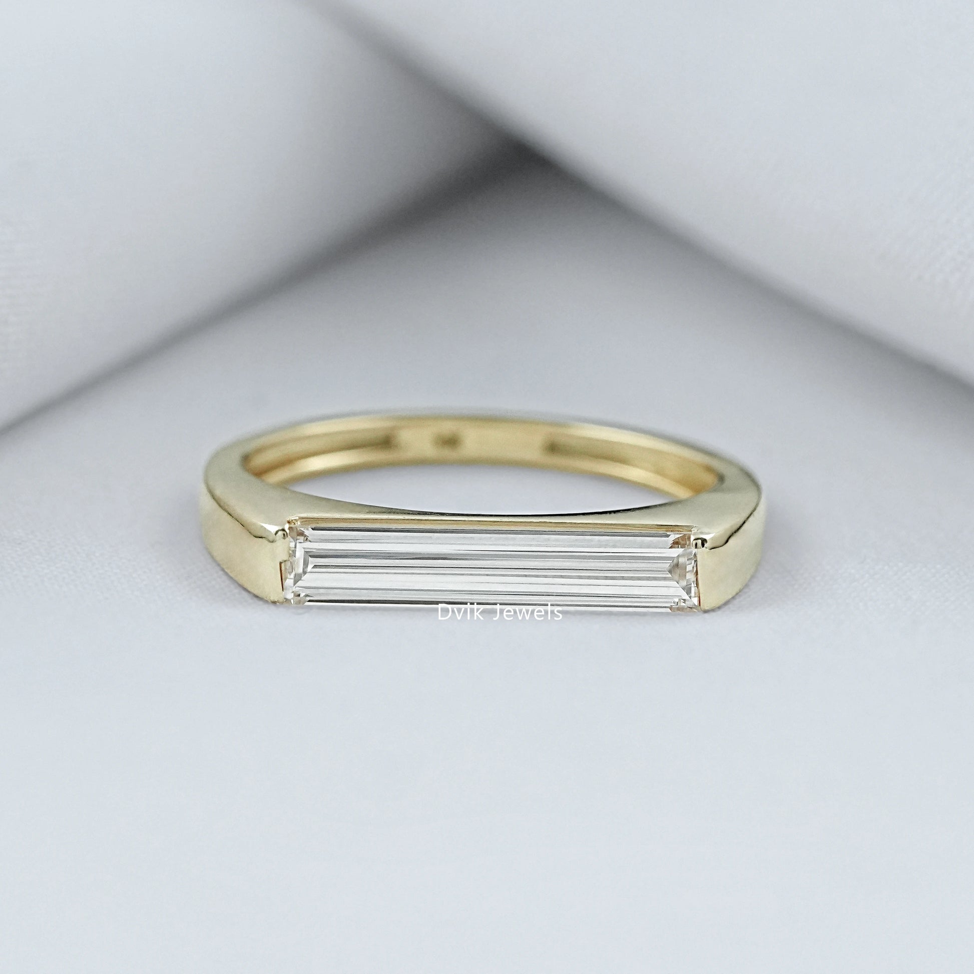 East West Baguette Diamond Ring in a 14k gold bezel setting