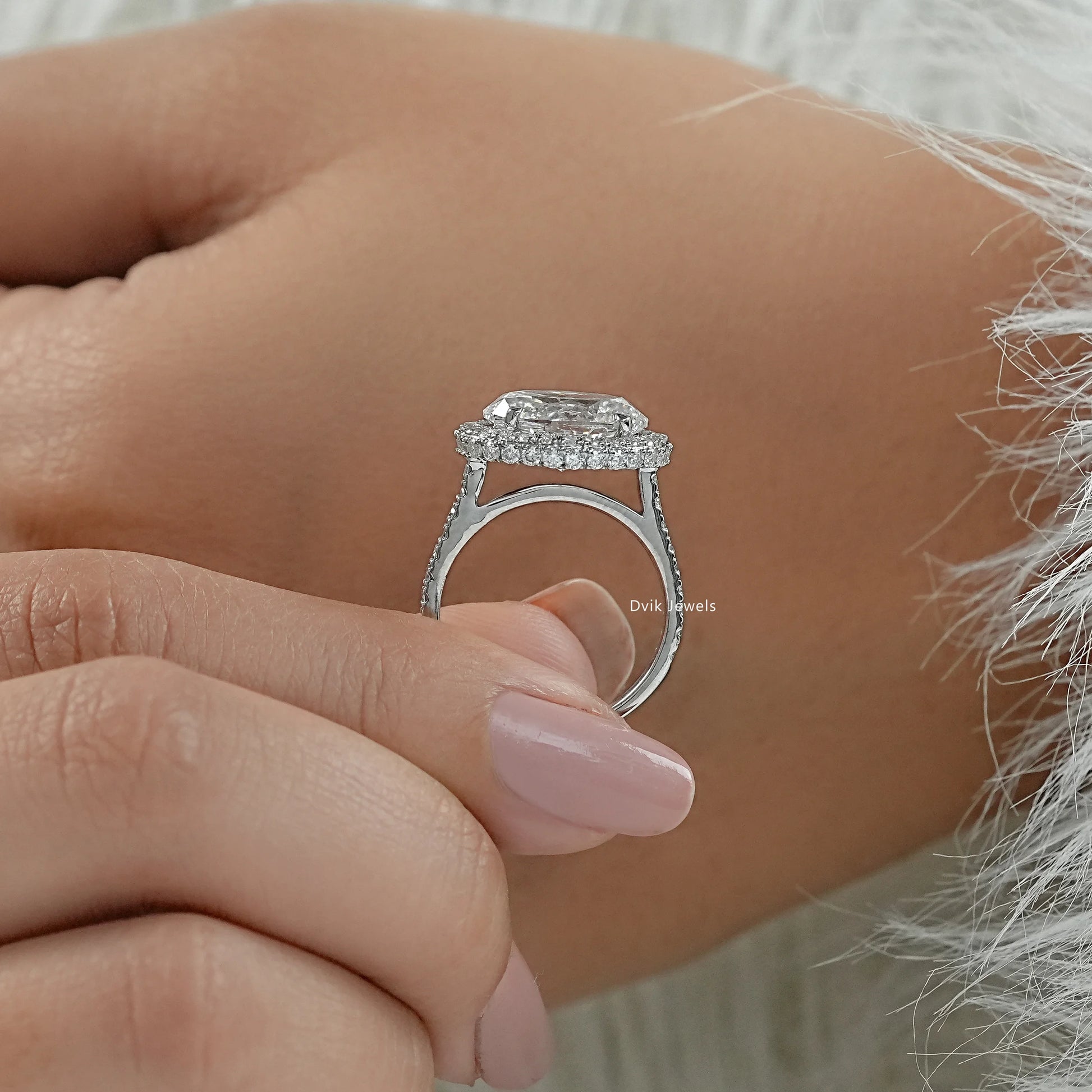 Oval lab grown diamond ring close-up on a white surface for sharp detail