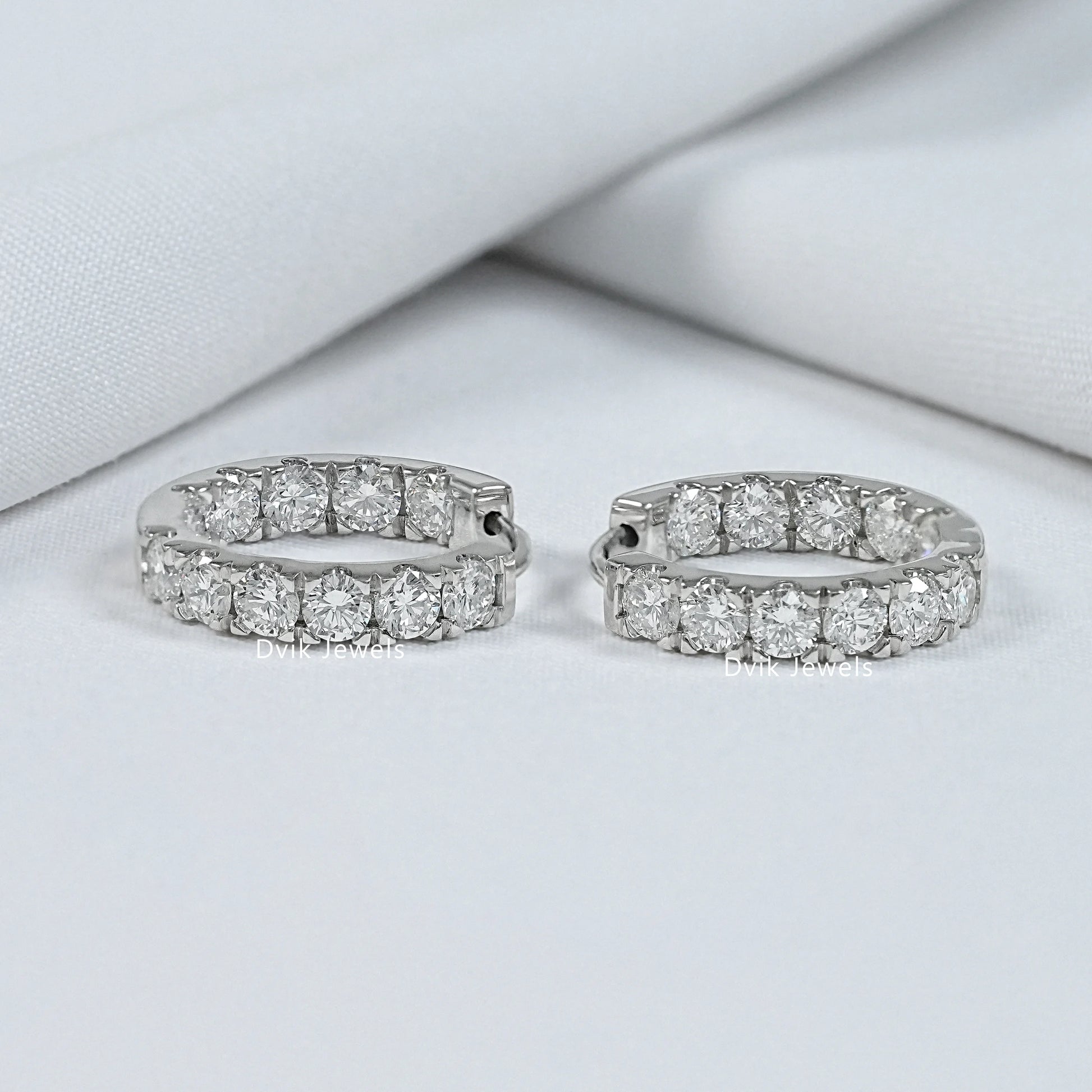 Front pair view of Dvik Jewels inside out hoop diamond earrings with a full row of lab diamonds.