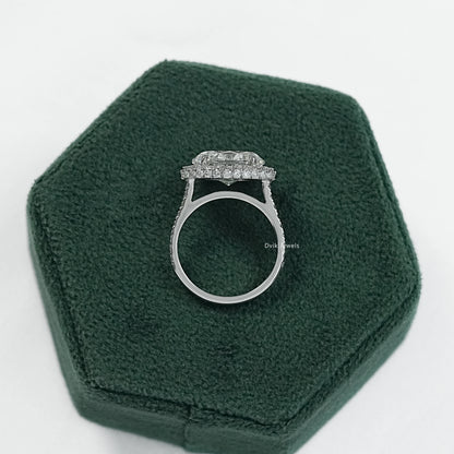 East west oval engagement ring held to showcase the unique horizontal setting