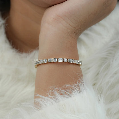 Hand view of mixed cut tennis bracelet for women in yellow gold