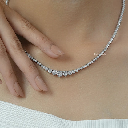 3 ct diamond tennis necklace held to show the high quality round stones.